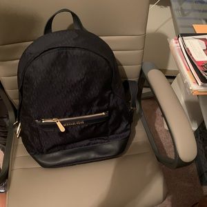 Micheal Kors medium navy back pack purse